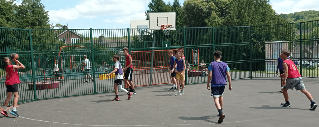 Young people playing basketball