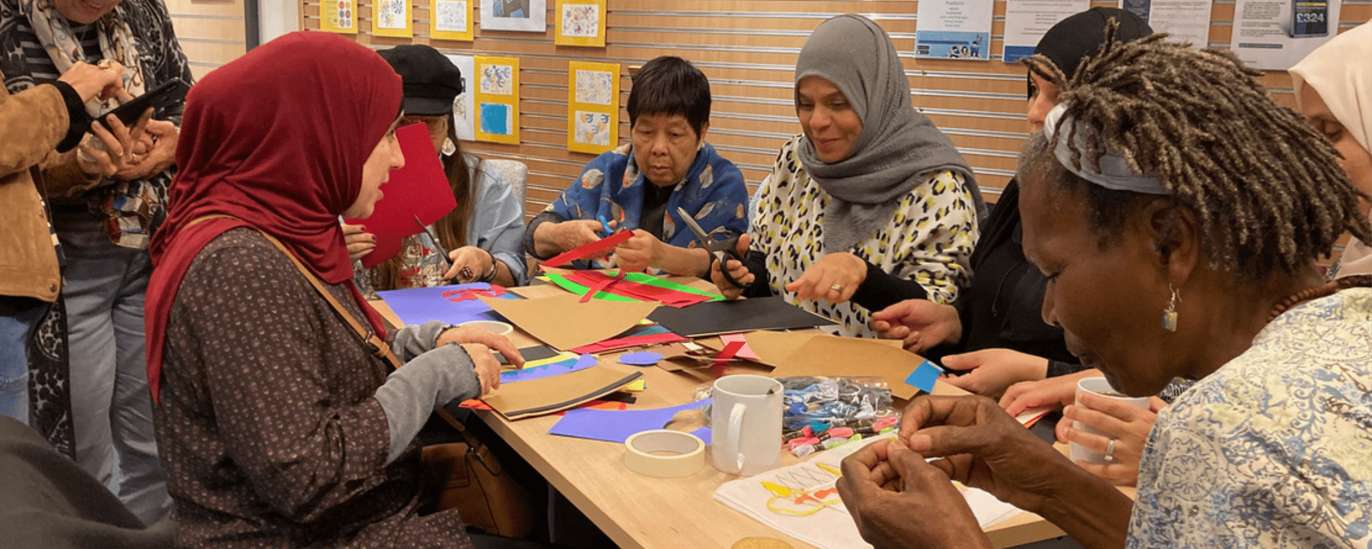 One lady serving food to three seated older people