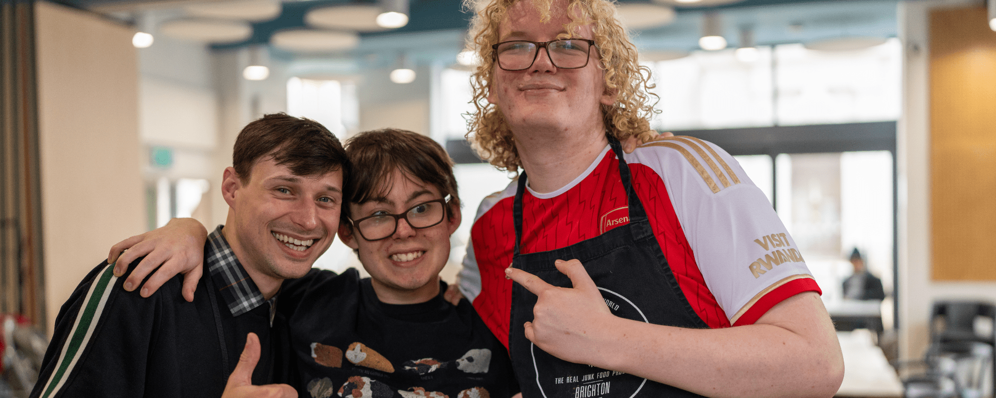 one woman and two men preparing food 