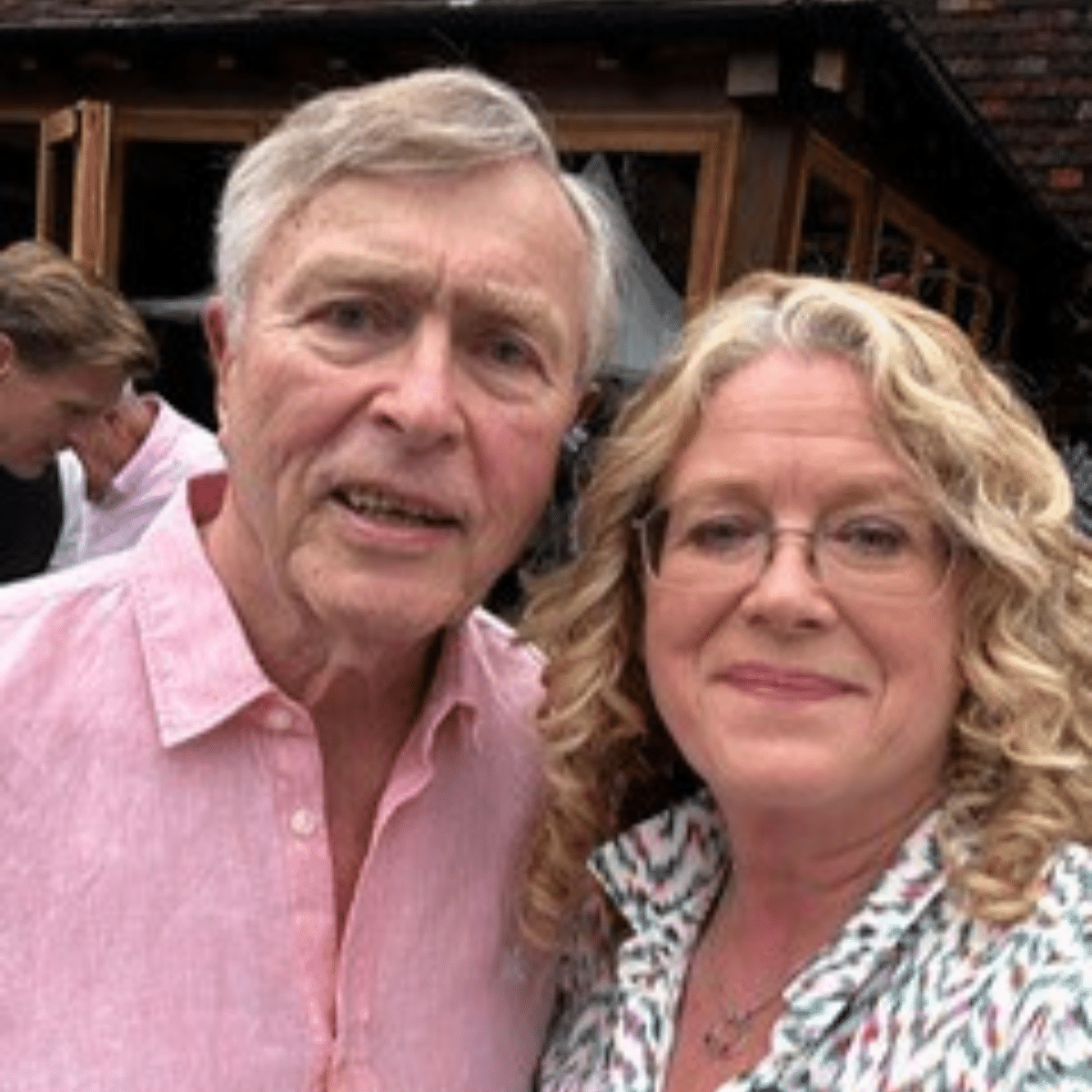 Humphrey Price and daughter Jo Beard smiling to camera